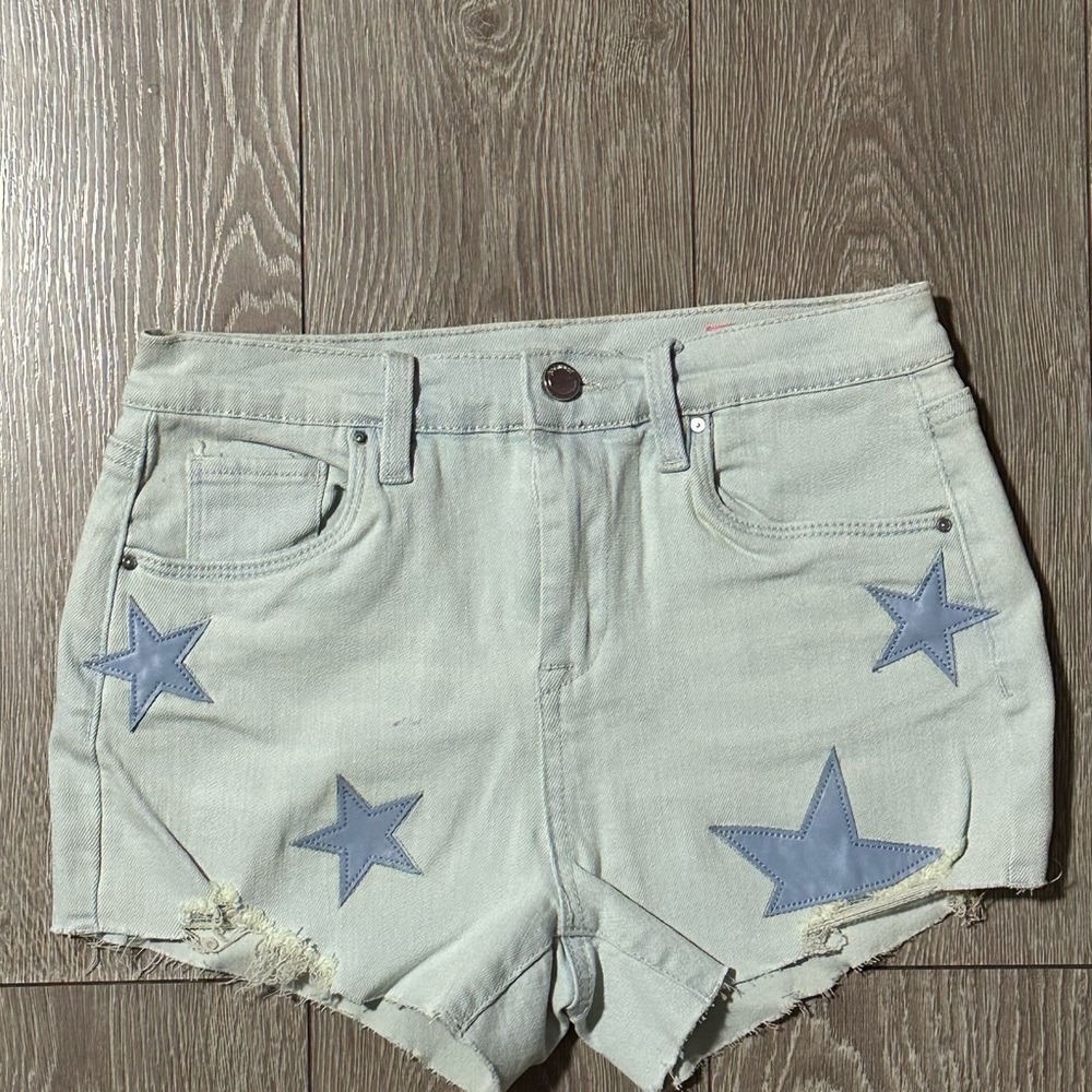 Jean shorts for kid size 14. There is a very small purple stain (slide 2).